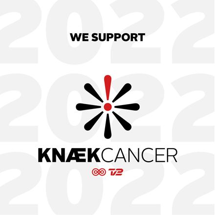 Cancer flower in black and red with black text and red Cancer and TV2 logo on of faded 2022 numbers in the background