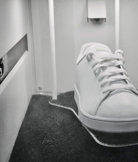 White sneakers placed inside IMBOX Flagship and getting the IMBOX treatment