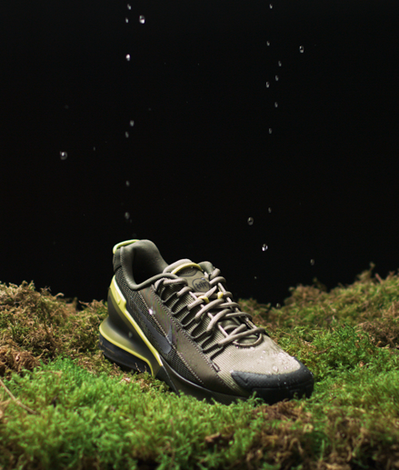 Green and brown Nike outdoor shoe repelling water