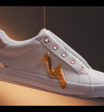 White canvas shoes covered in sticky honey