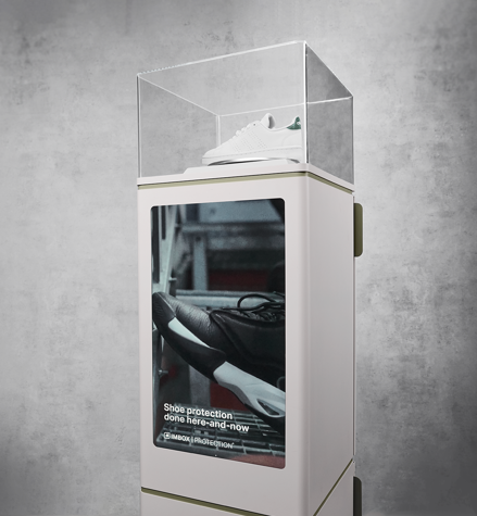 Black IMBOX Original shoe protection machine on gray background