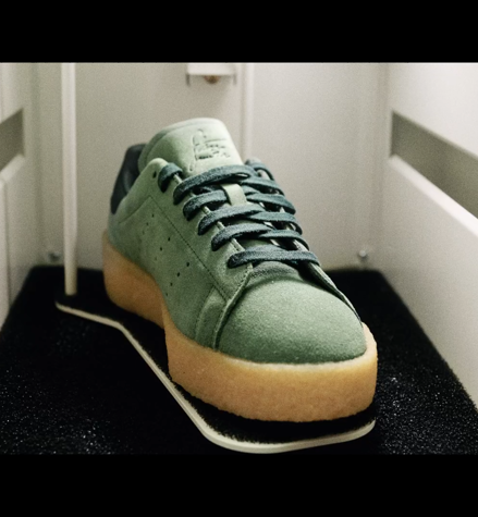 Green sneakers inside the IMBOX Flagship