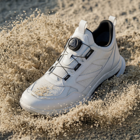 IMBOXed and protected white golf shoe in sand