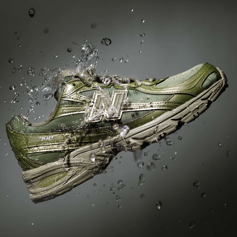 Green New Balance sneaker with water