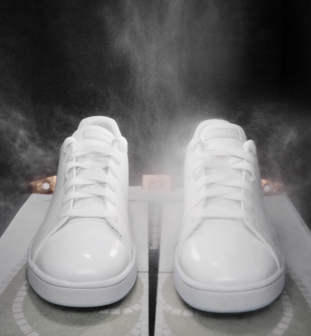 White sneakers placed inside IMBOX Original and getting the IMBOX treatment