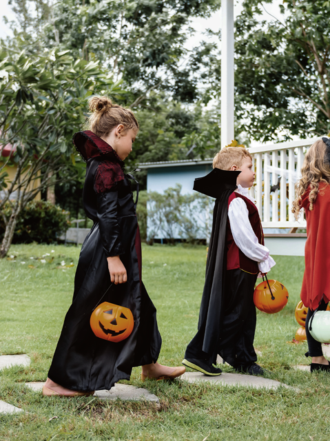 Children dressed up for Halloween going trick or treat