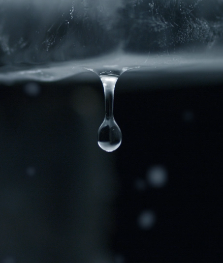 Close-up of raindrop falling down