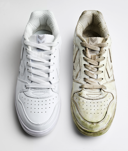 Clean and dirty white sneakers placed next to each other