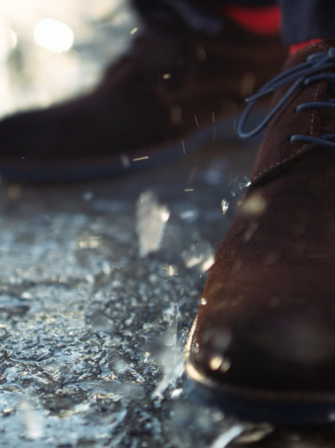 IMBOXed brown leather shoes standing in the rain