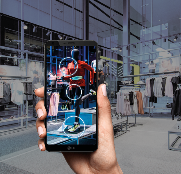 Customer using a smartphone to get info about clothes in store