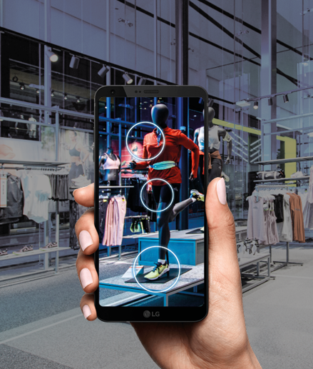 Customer using a smartphone to get info about clothes in store