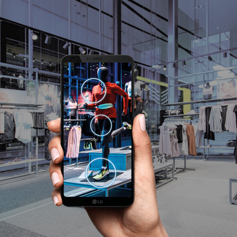 Customer using a smartphone to get info about clothes in store